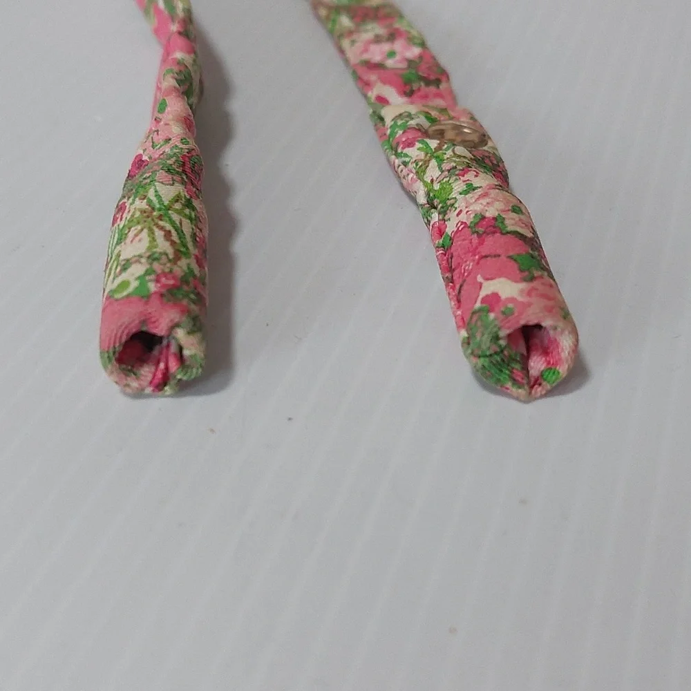 Lilly Pulitzer floral sunglass strap with pink and green colors.
